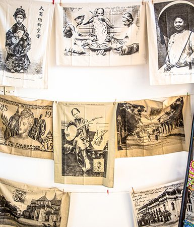 Vintage photos printed on fabric displayed at Saigon Kitch
