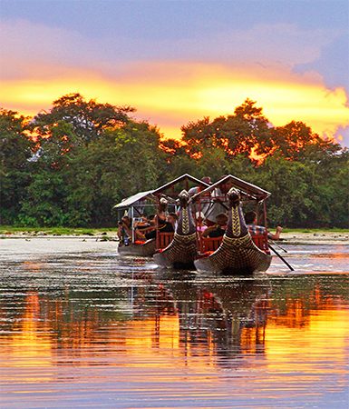 Boats at sunset on moat Angkor Thom Angkor