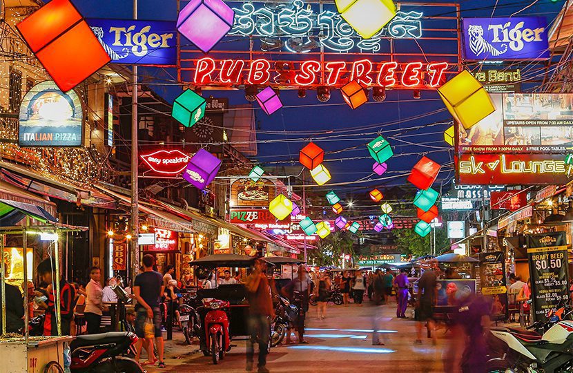 Restaurants and lights along Pub Street in Siem Reap at night by mikecphoto Bars