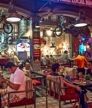 Night look of cafe and restaurants near the famous Pub Street by gagula