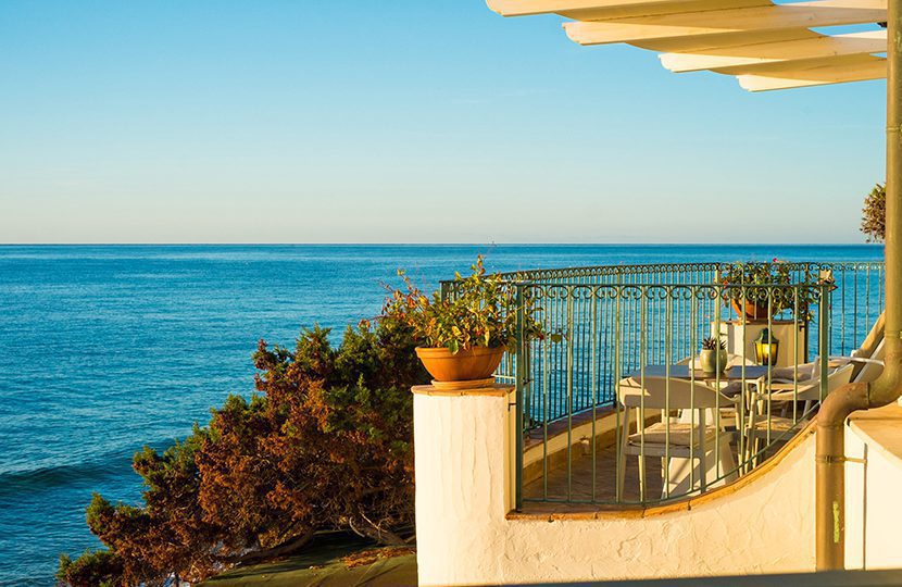 Waterfront suites at Forte Village open to expansive views of the Mediterranean Sea