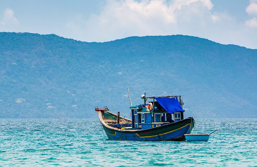 Boats and tropical beach, Con Dao island, Con Son bay by Tonkinphotography