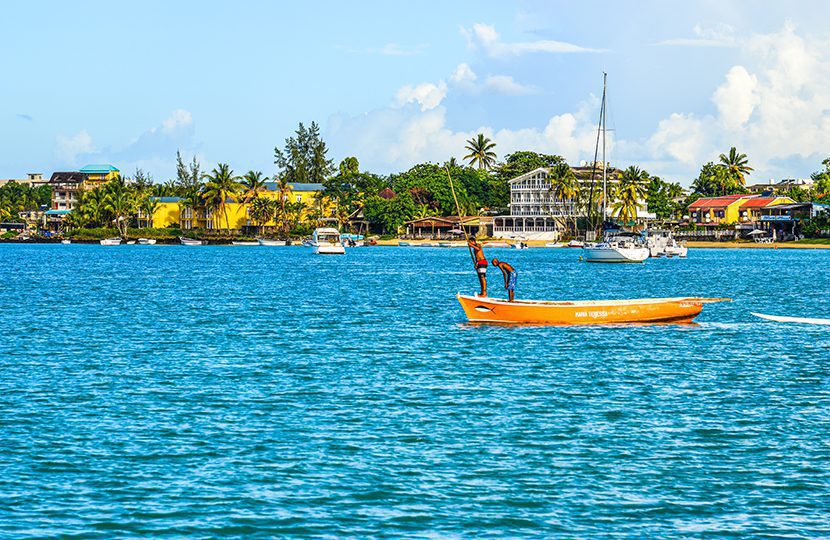 Local men rowing boat on sea in Grand Baie, Mauritius By Phuong D. Nguyen
