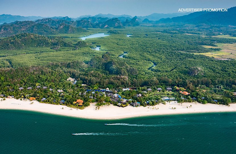 Aerial view of Four Seasons Resort Langkawi, playing hide and seek amongst the lush green and white landscape