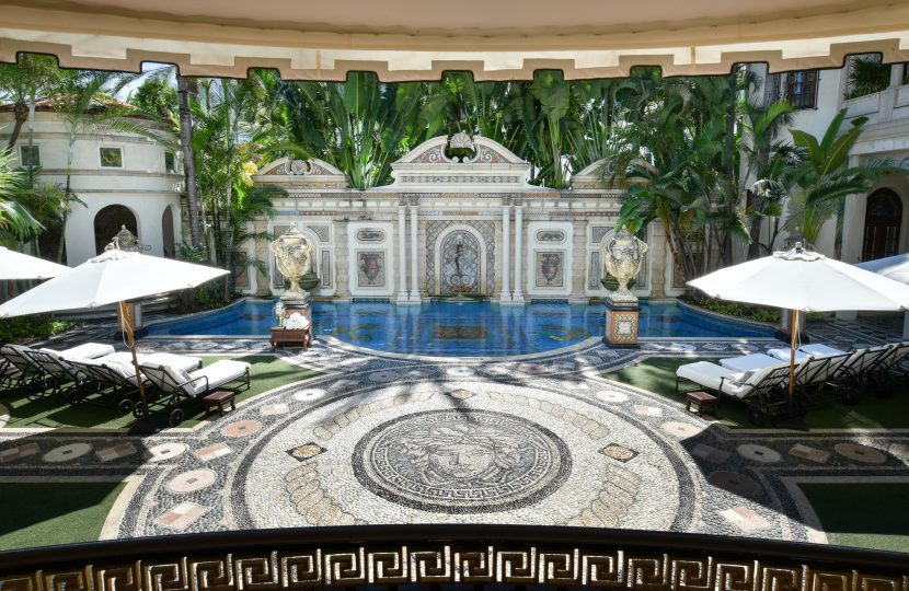 Mosaic swimming pool lined with 24-karat gold, featuring Versace’s Medusa logo