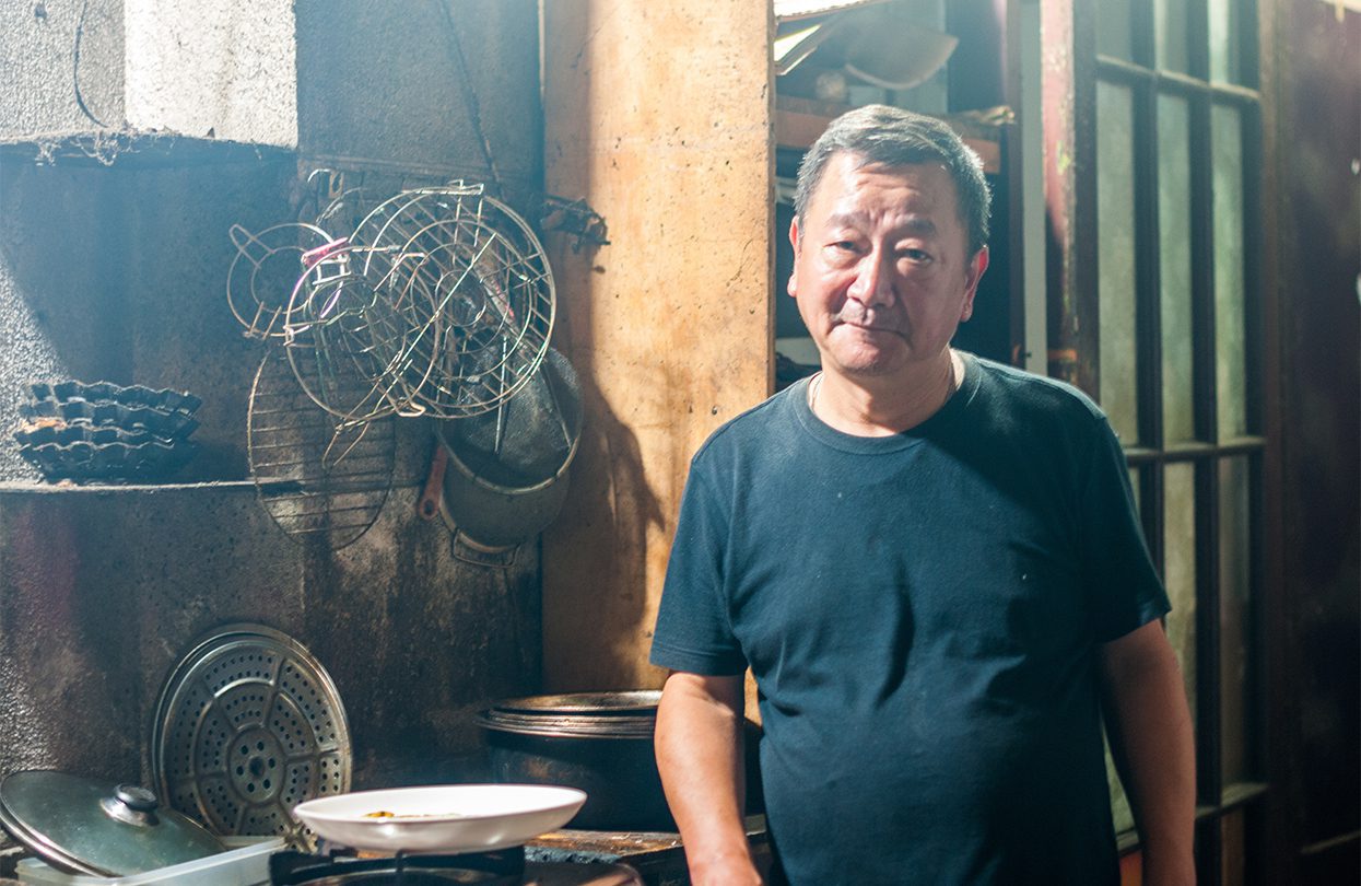Mr Yu in his open kitchen - 