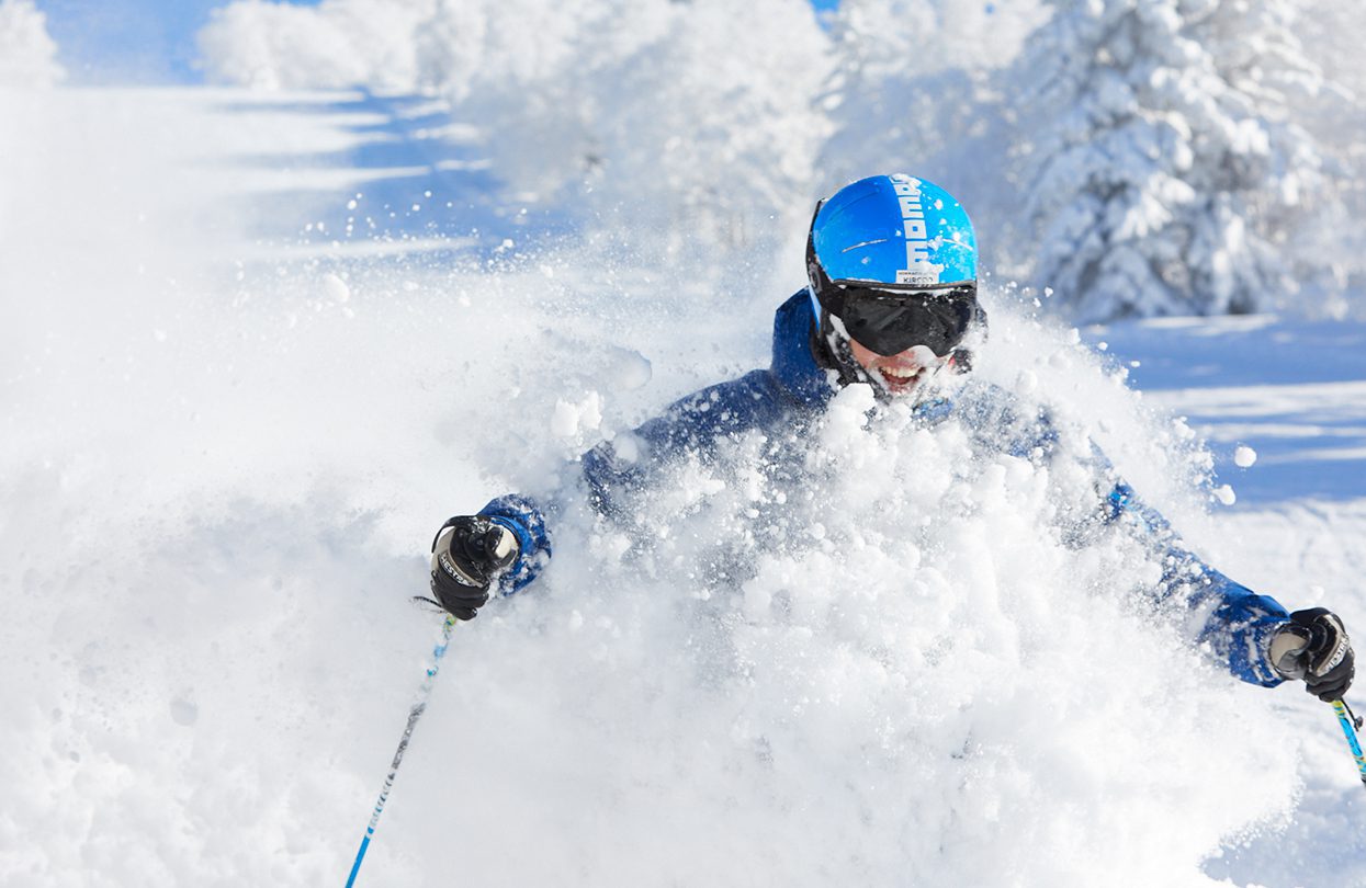 Skiing through powdery snow