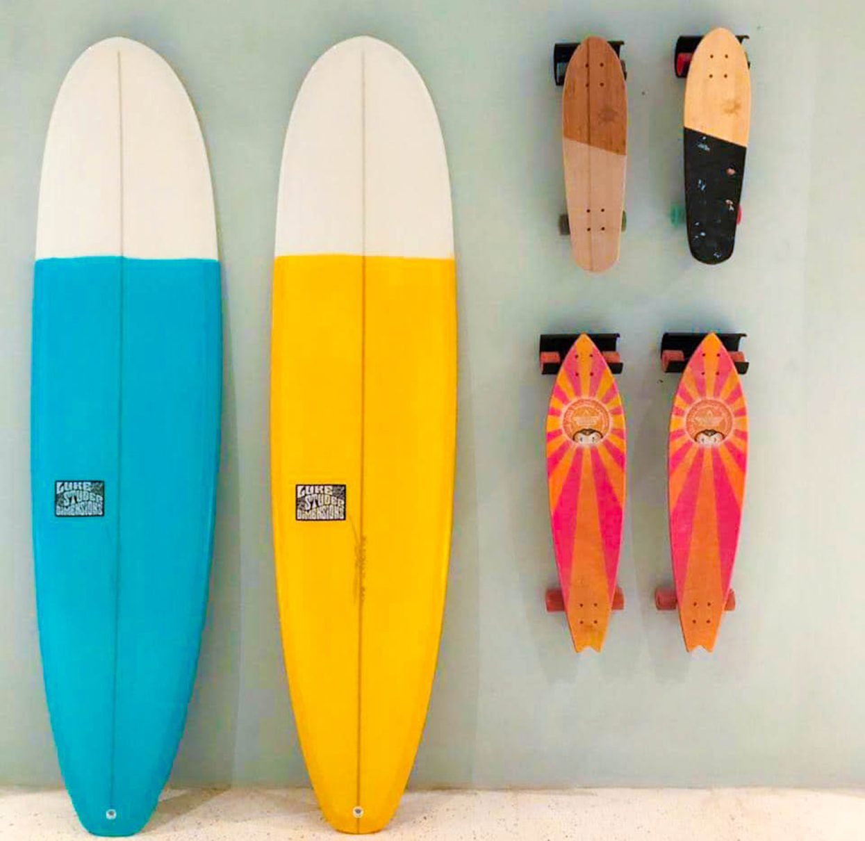 Colourful surfboards and skateboards are free for guests to borrow