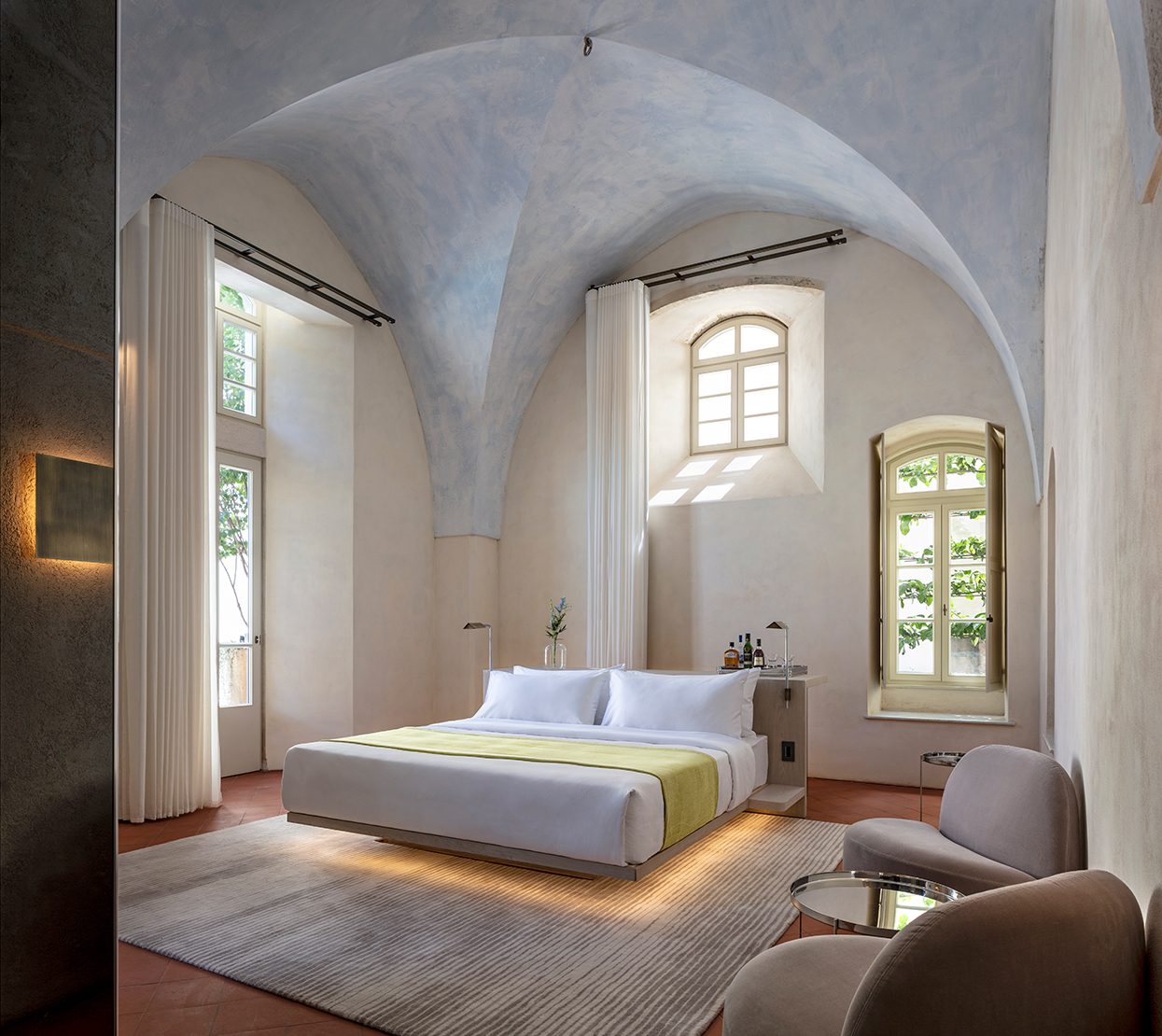 Deluxe Junior Suites have arched ceilings and lots of sunlight by Amit Geron