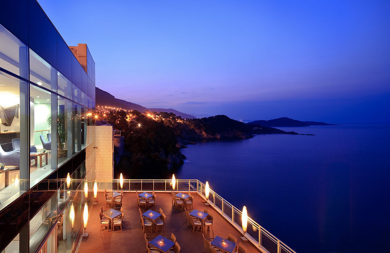 Indulge in a romantic meal on a terrace overlooking the ocean