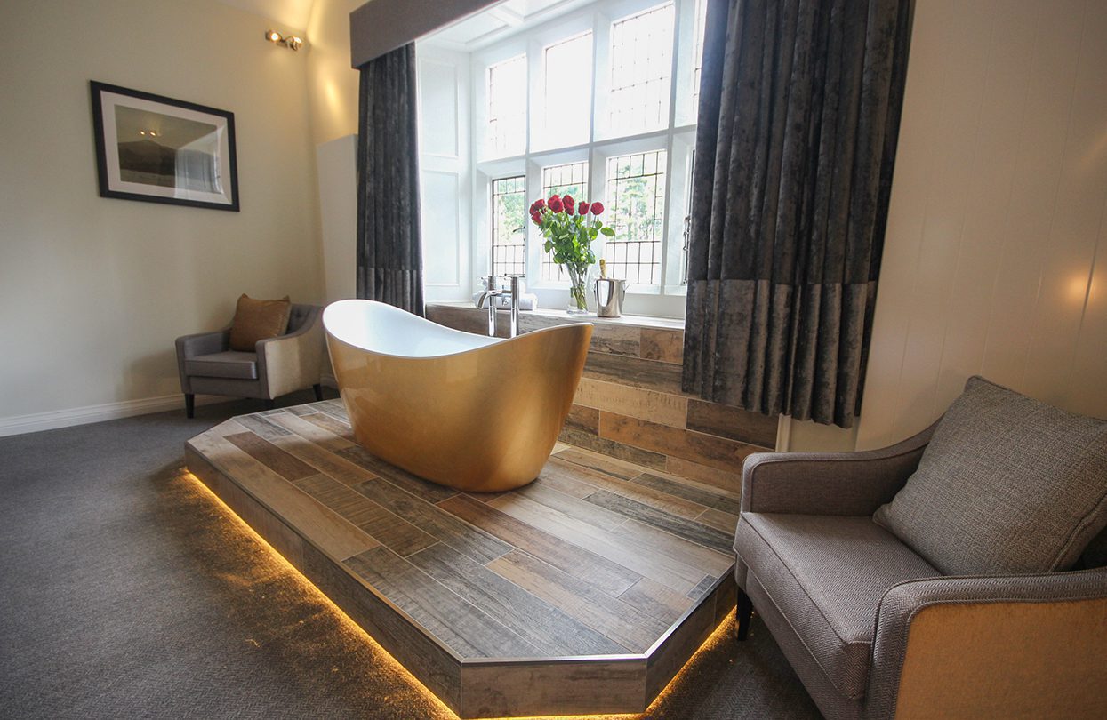 The slick bathtub overlooks the greenery - ensuring absolute privacy