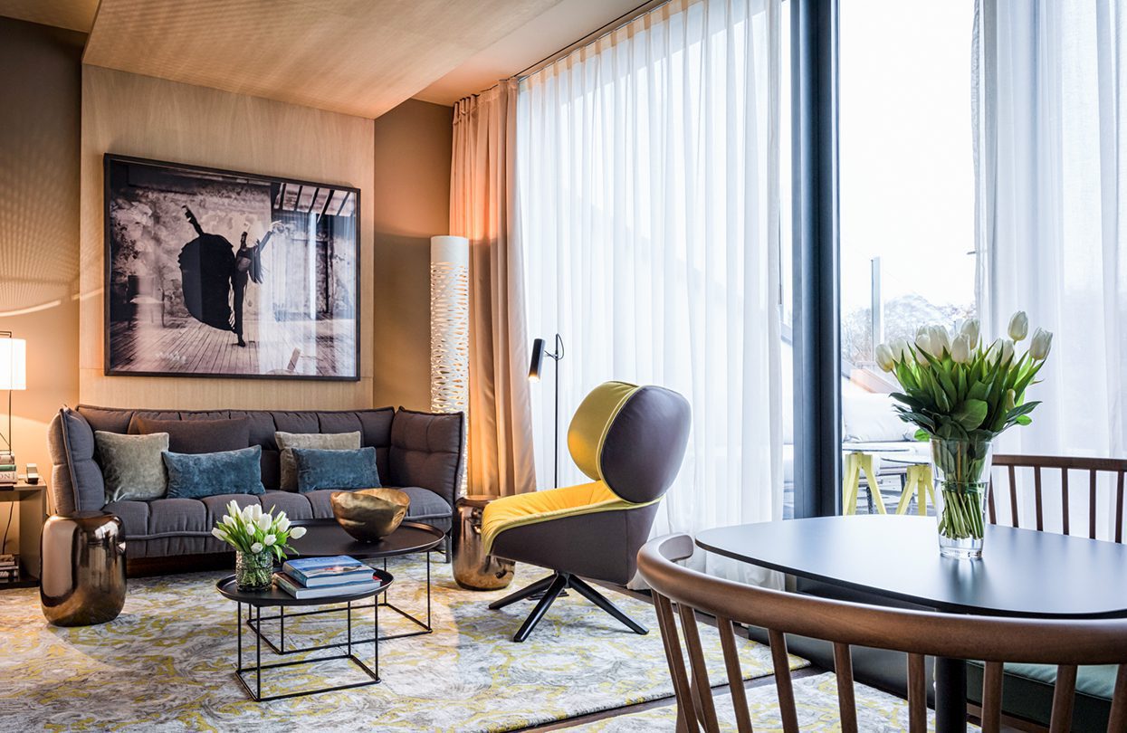 The penthouse suite's living room has a great view of downtown Berlin