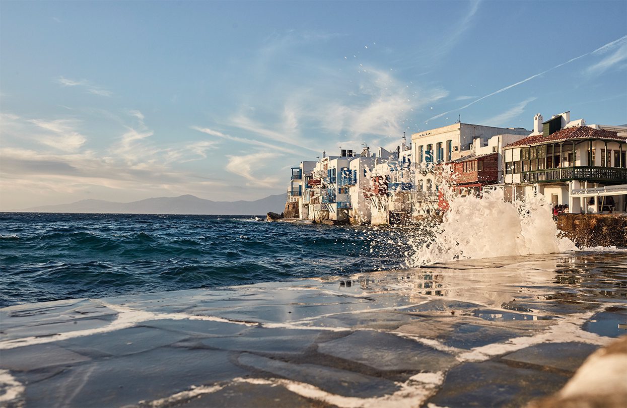 Breaking the waves at the district of Little Venice in Mykonos