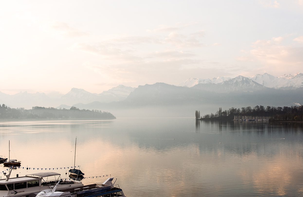 The Alps peek over the banks of Lake Lucerne