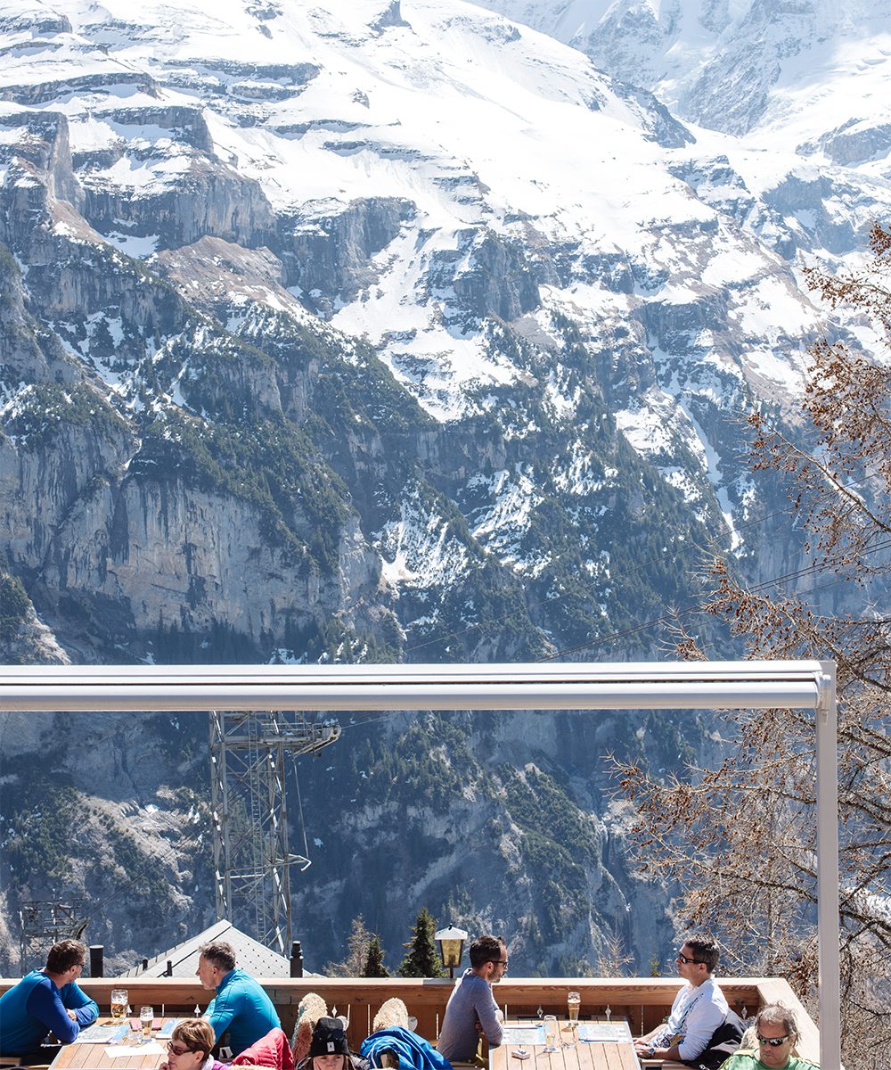 Terrace with stunning mountain views at Hotel Alpenruh in Mürren