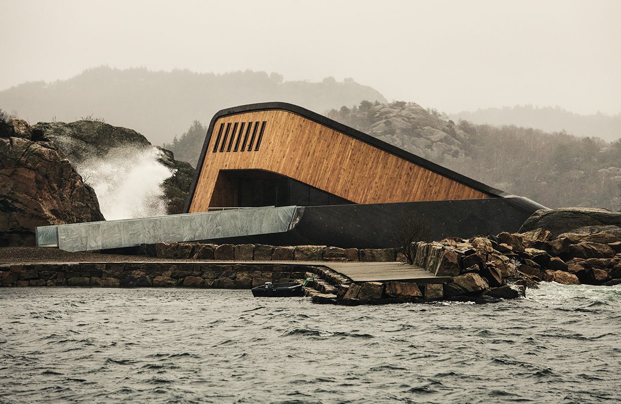 Under restaurant holds steady as the waves crash nearby photo by Ivar Kvaal