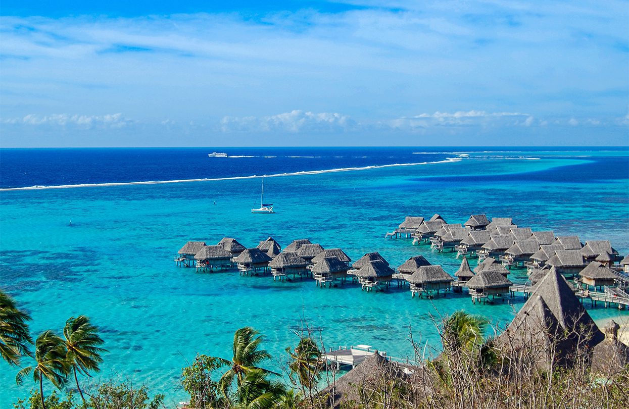 Overwater bungalows in the lagoon of Moorea in French Polynesia