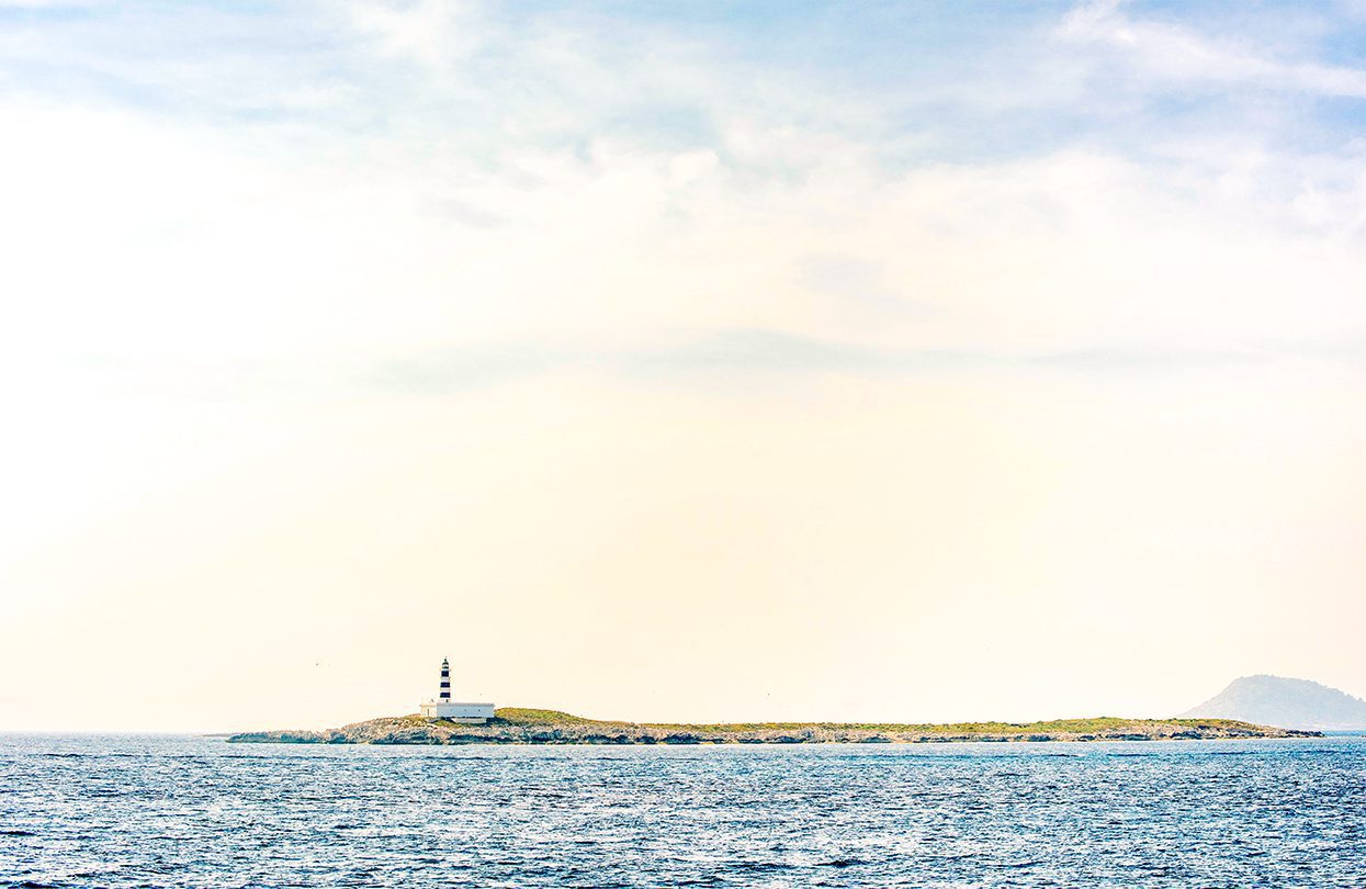 Landscape of Es Palmador lighthouse from the boat