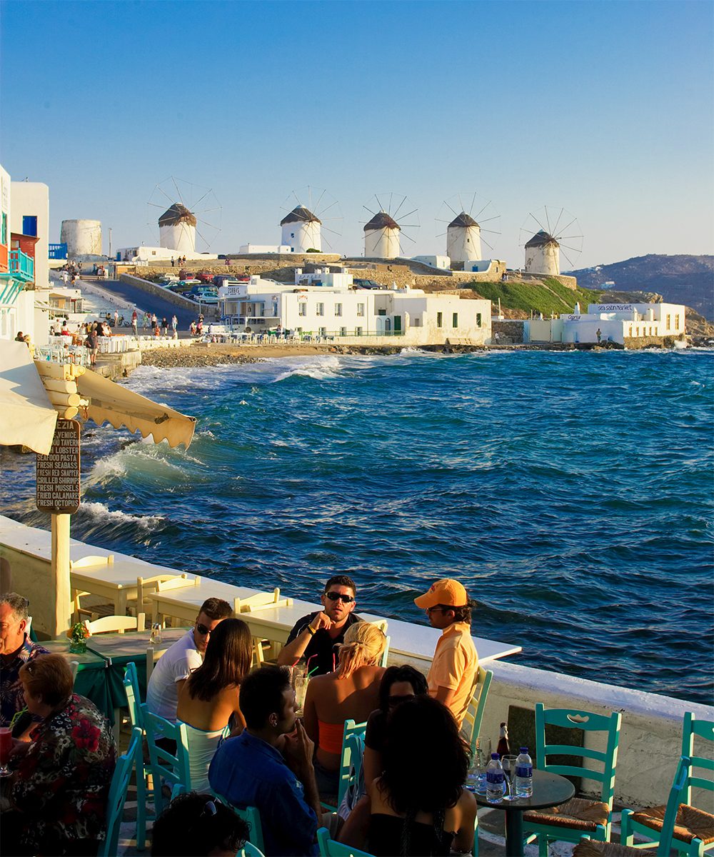 The iconic Windmills of Mykonos! A cocktail at Little Venice is a must
