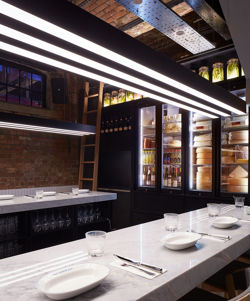 Huge blocks of cheese waiting to be tried at The Cheese Bar in London