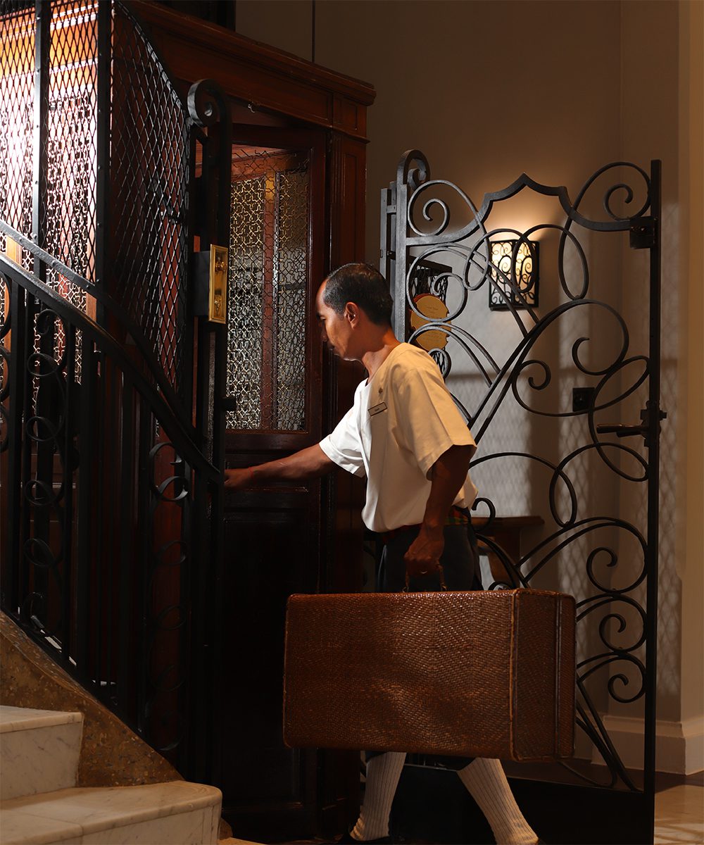 The legendary cage elevator ferries guests up and down the Heritage Wing at Raffles Grand d’Angkor