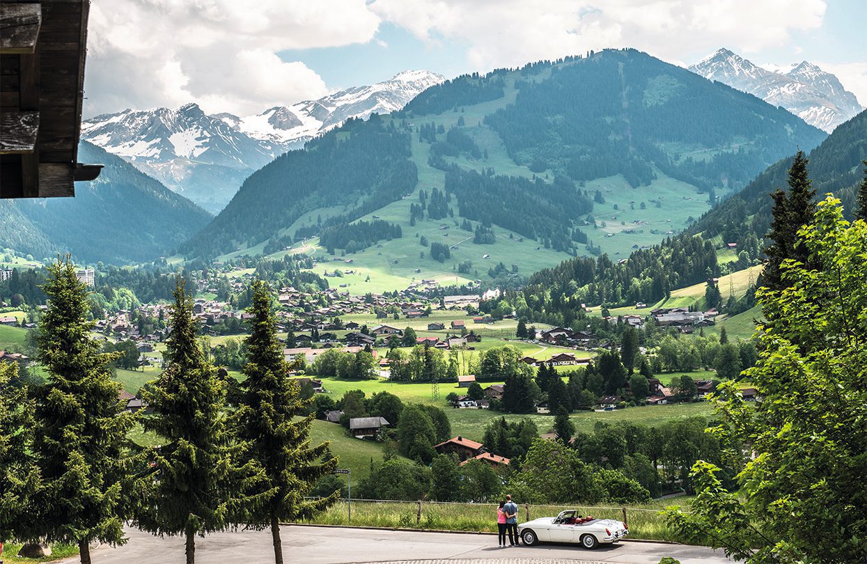 Gstaad village, as the snow retreats, its more fun in the green summer fields