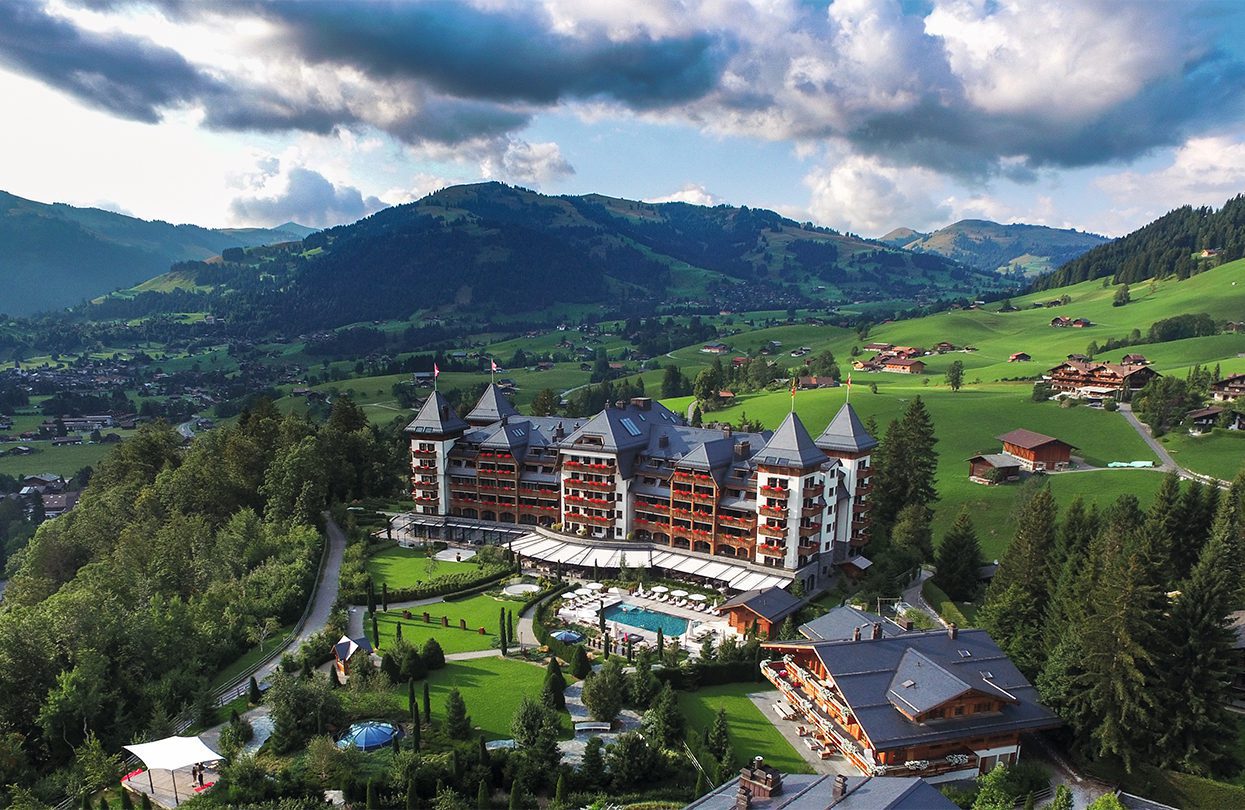 Sunrise in the summery Gstaad with the Gstaad Palace emerging supreme