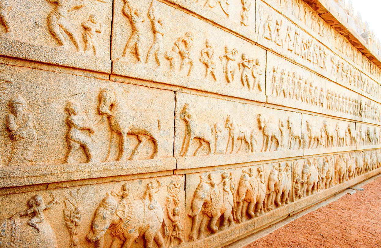Inscriptions from ancient texts adorn the walls of Hampi’s temples