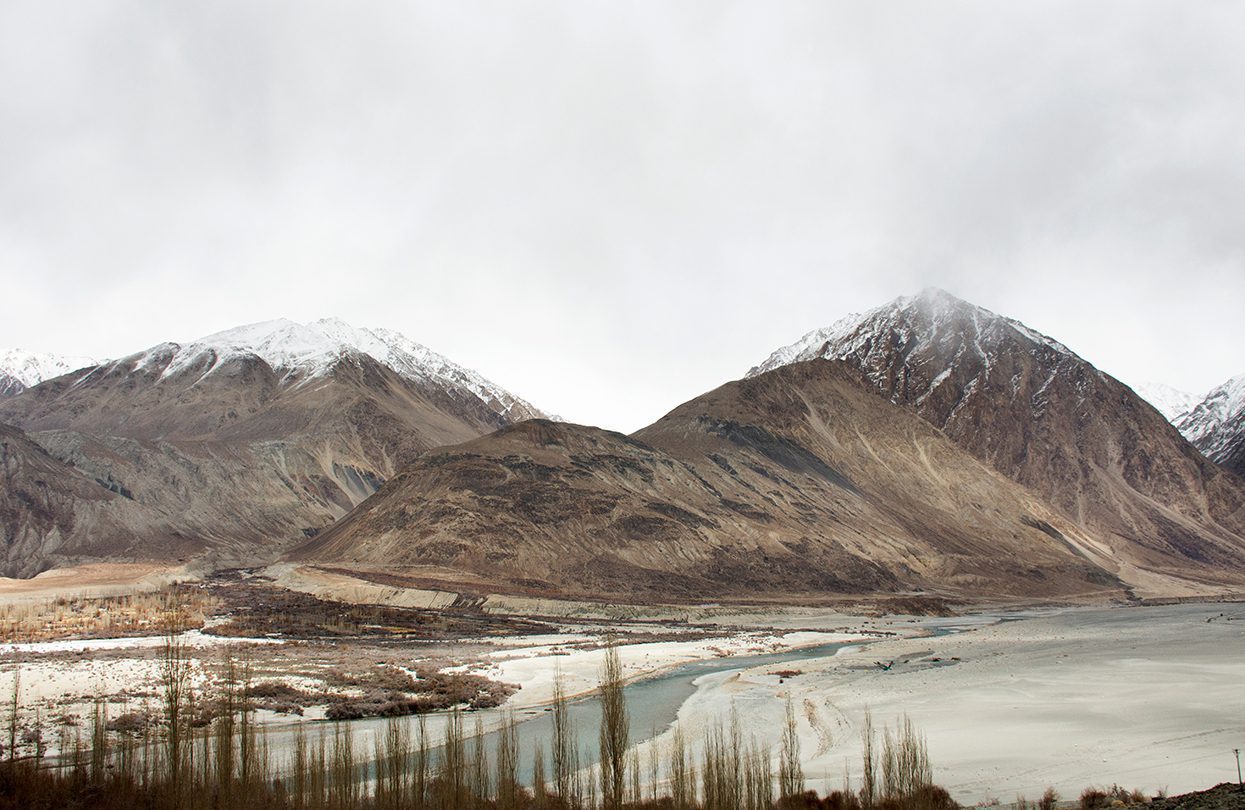 View landscape mountains range with Nubra and Shyok River between Diskit Turtok highway road (image by Anirut Thailand)