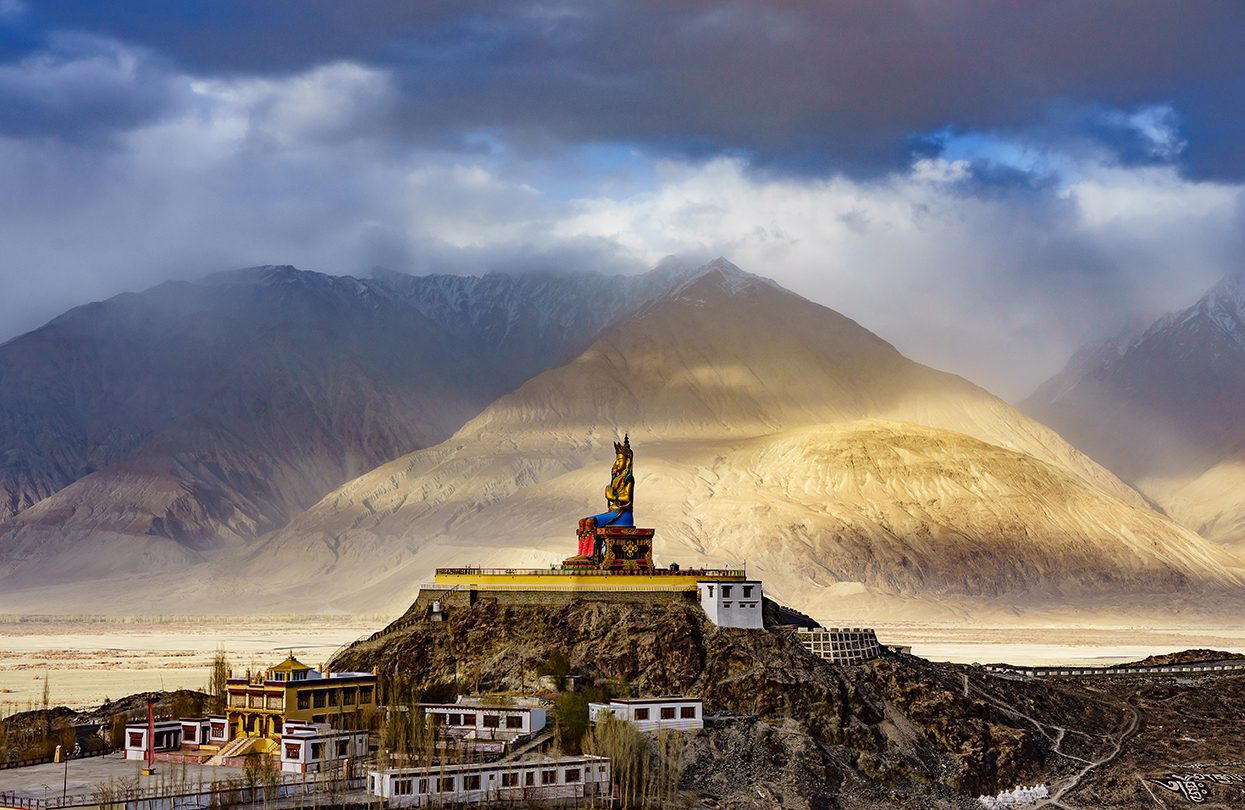 The Maitreya Buddha statue with Himalaya mountains in the background from Diskit Monastery or Diskit Gompa, Nubra valley, Leh (image by NavinTar)