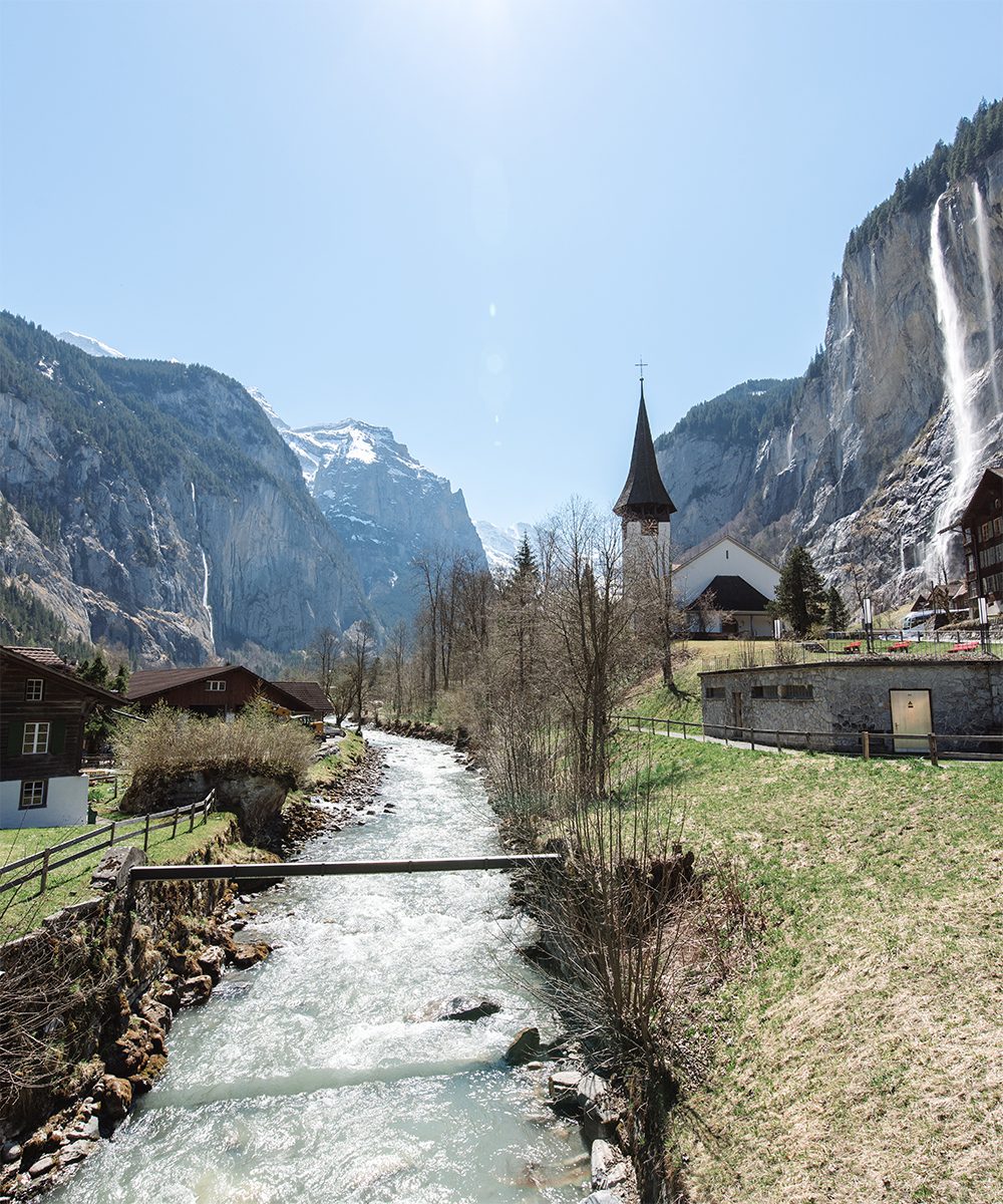 A church glimpsed from the train by the stream at Lauterbrunnen