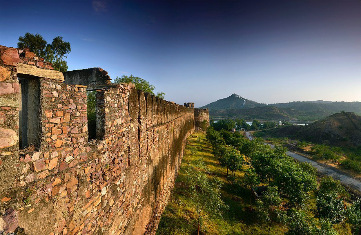 Verdant green creates a wild backdrop against India’s Fort Barwara