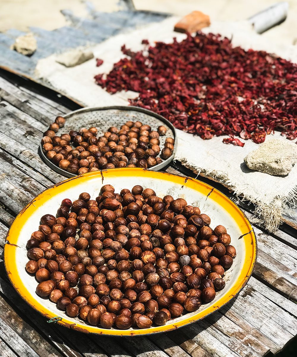 Freshly harvested nutmeg and mace dry in the sun in the Banda Islands