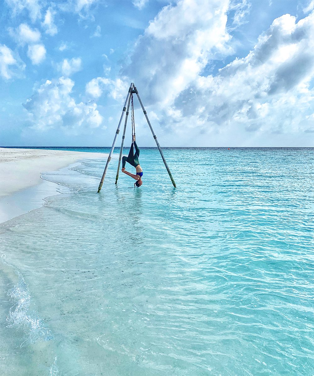 Overwater Yoga at Anantara Kihavah Maldives Villas