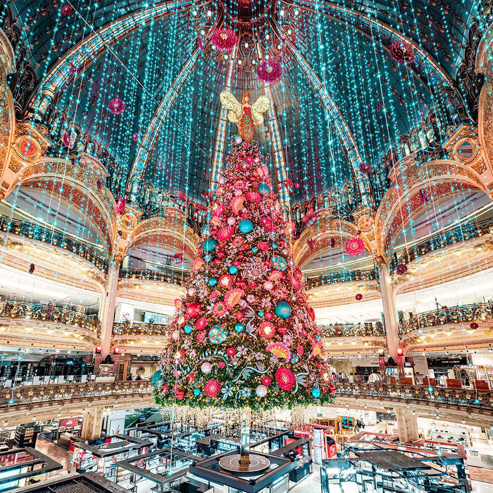 Galeries Lafayette Paris Haussmann's centrepiece, a show-stopping Christmas tree an extravagance of colour and décor that rises tall at the heart of this luxury department store