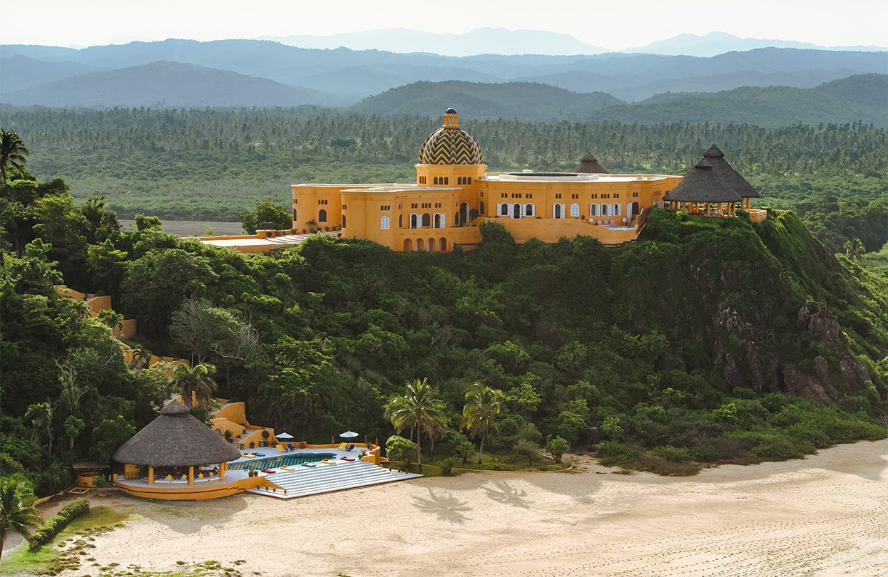 Cuixmala stands out in its unique tinge of orange colour against a shade of blue and green, by Davis Gerber