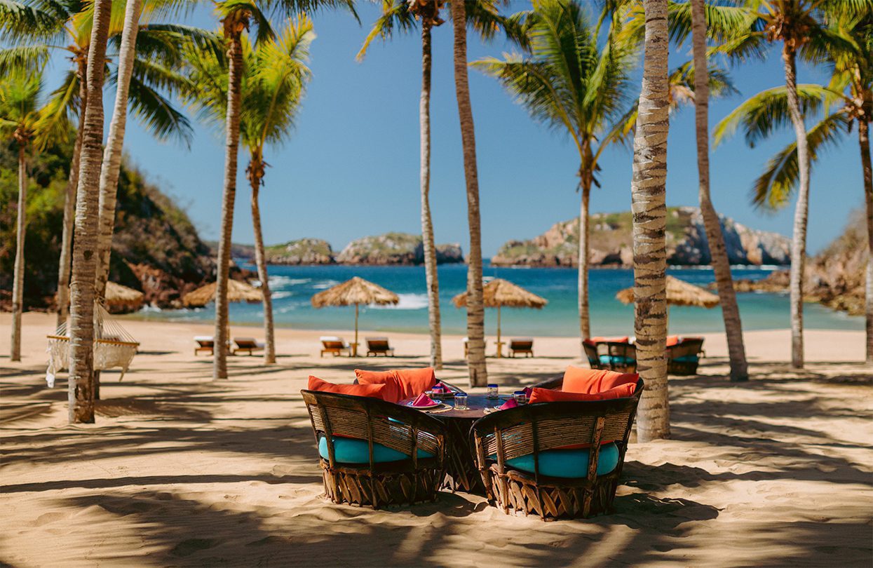 The outdoor cabanas and easy sitting under palm trees is the ideal place to dream of the sea, by Davis Gerber