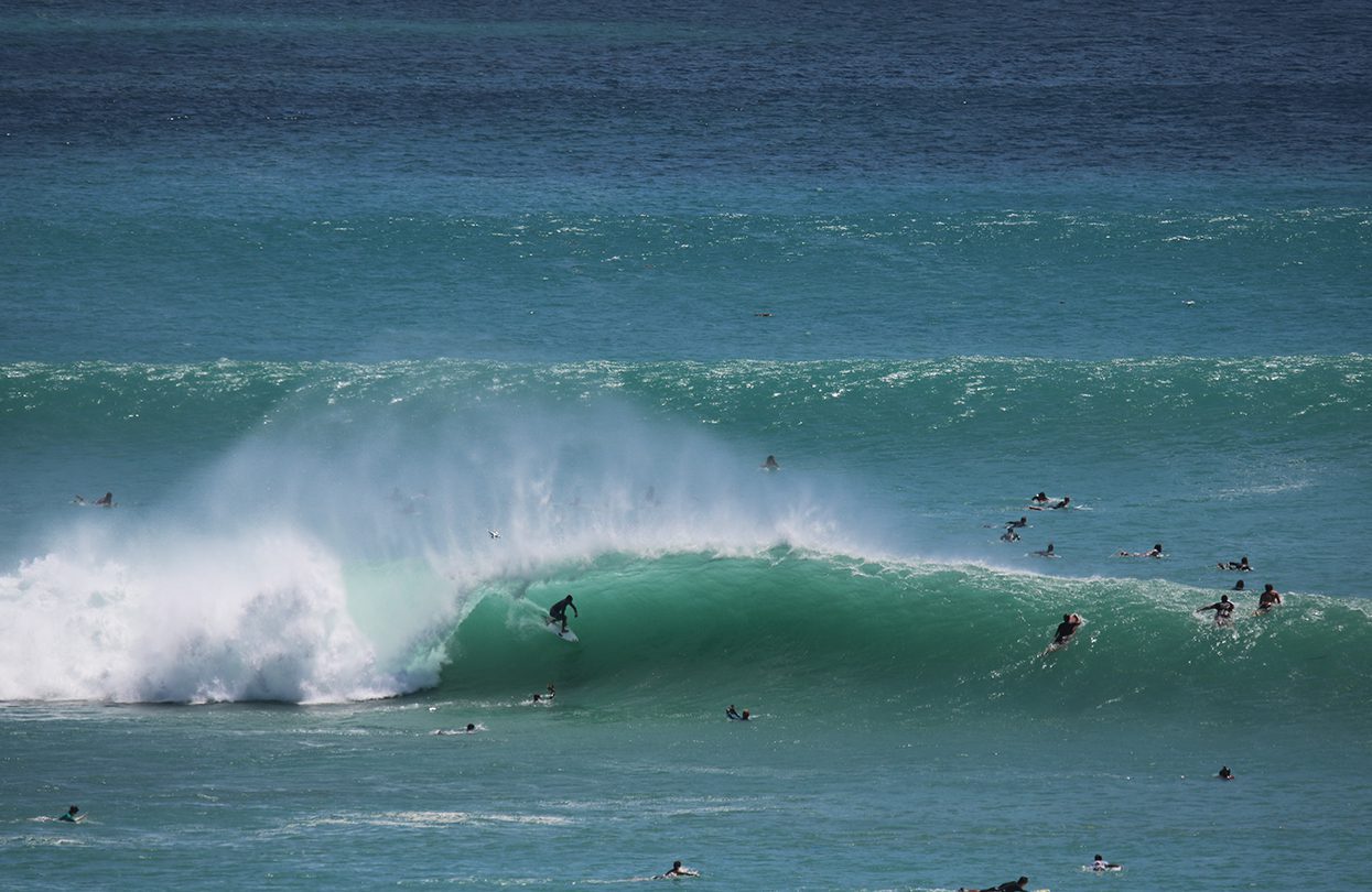 Surfers at Padang Padang in Bali