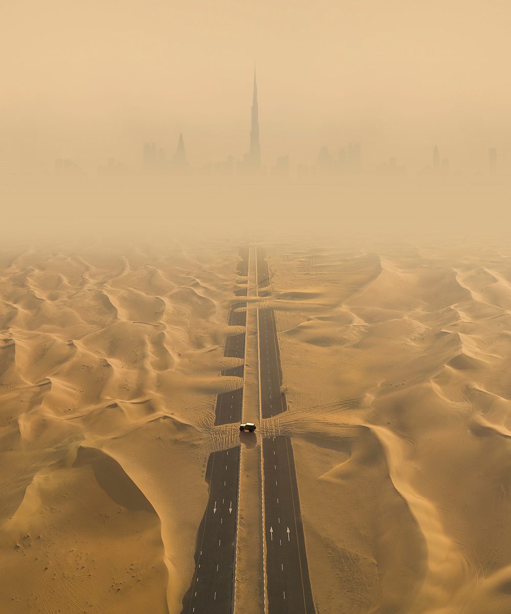 Dubai Desert with Burj Khalifa in the skyline, by Dubai Tourism