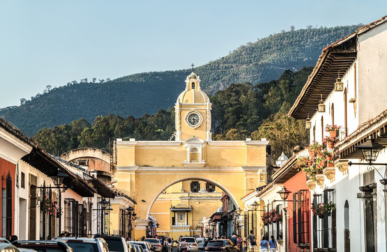 The Santa Catalina Arch and Agua Voclano in Antigua Guatemala, Guatemala, photo by Leonid Andronov