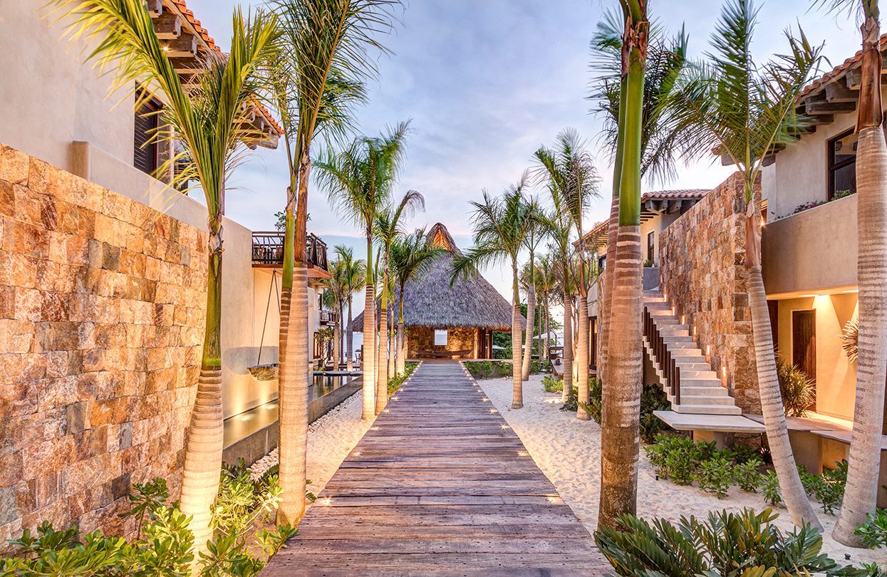 Casa Koko main entrance bridge at sunset