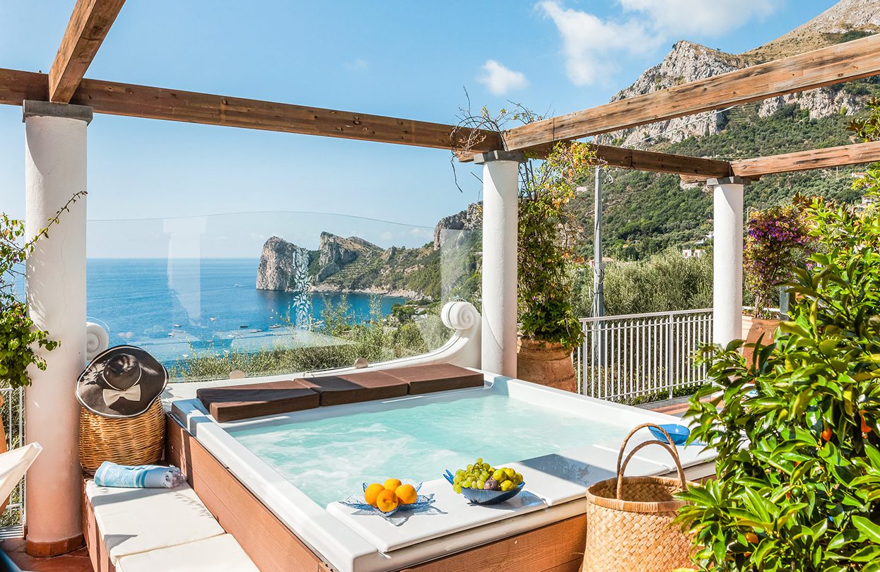 Outdoor jacuzzi with breathtaking views, both at the Villa Le Camelia