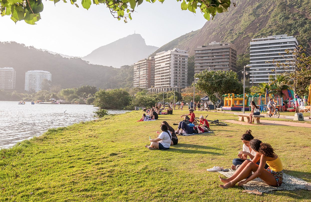 People enjoy the sun and peaceful surroundings of Lagoa Rodrigo de Freitas, photo by Joao Paulo V Tinoco