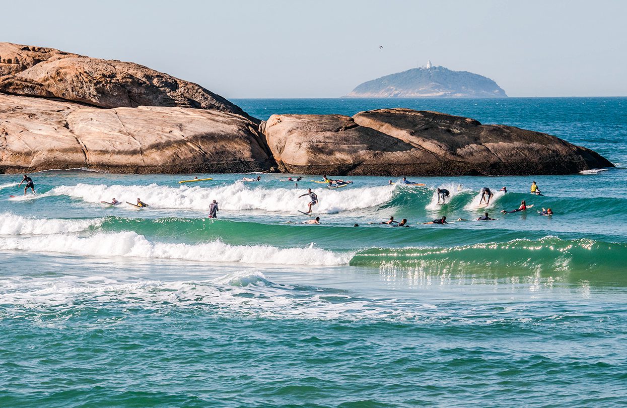 Surfers catching the waves at Arpoador, a favourite pastime in Rio, photo by Joao Paulo V Tinoco