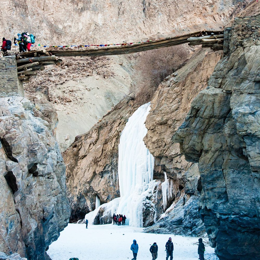 White Frozen waterfall between Mountains along Zanskar River, image by CreativesKit