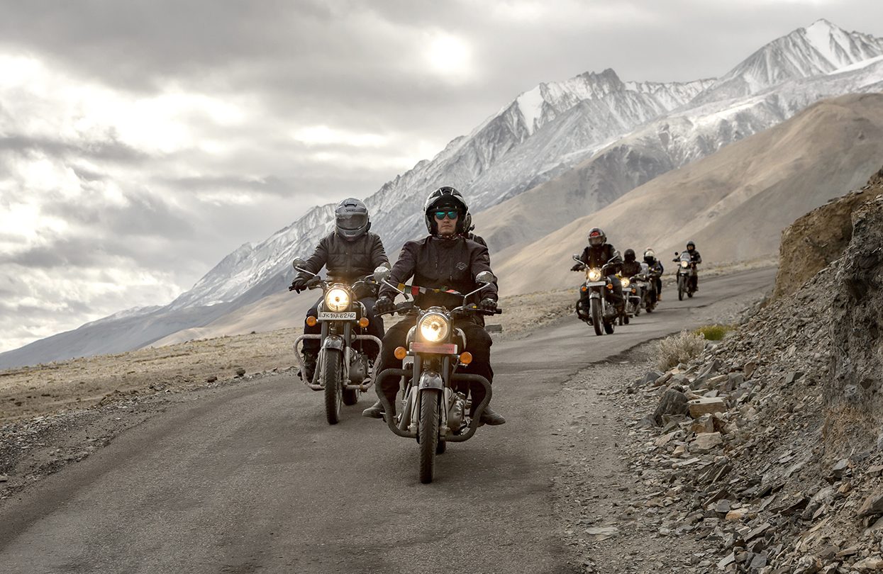 Biker riding on Snow Mountainin in Pangong Lake,Leh, image by Thampitakkull Jakkree