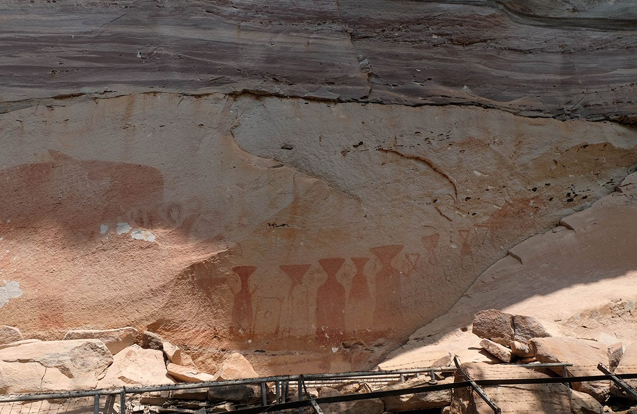 Group of Prehistorical paintings at Pha Taem. Showing hands, animals, image by Yanisa C