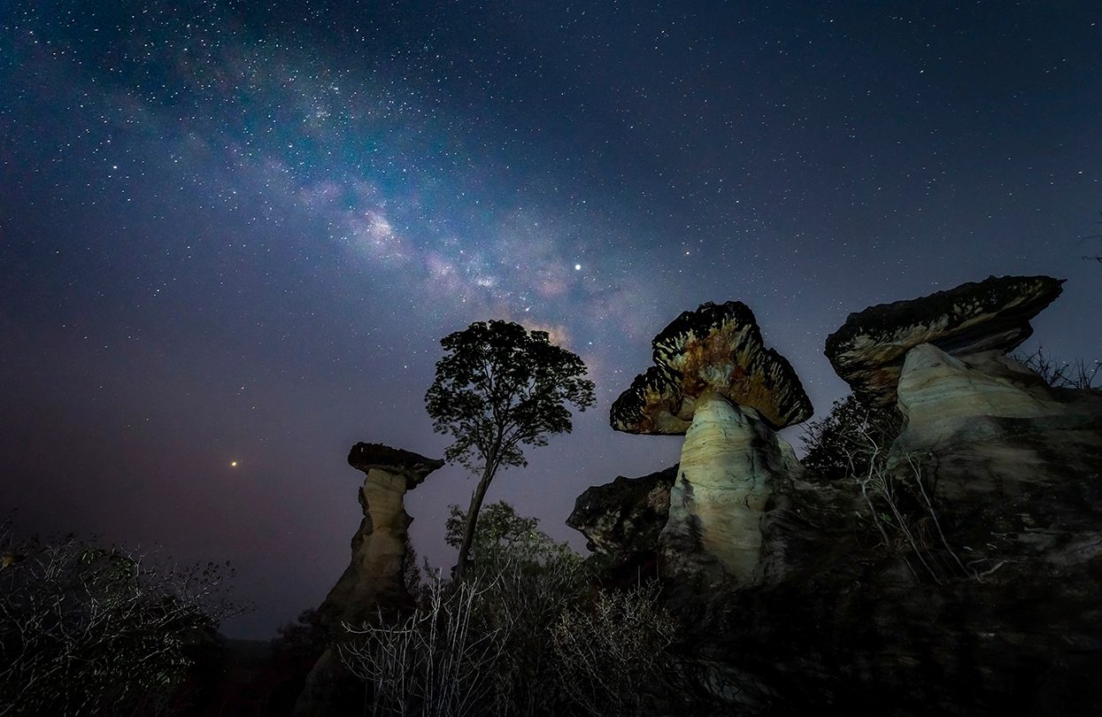 The Milky Way is above the natural stone pillars (Mushroom Rocks), Pha Taem National Park, Sao Chaliang, Ubon Ratchathani, image by keangs Seksan