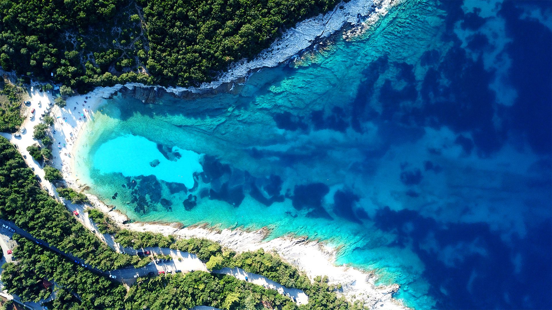 Aerial drone photo of tropical Caribbean bay with white sand beach and beautiful turquoise and sapphire clear sea, image by Aerial-motion