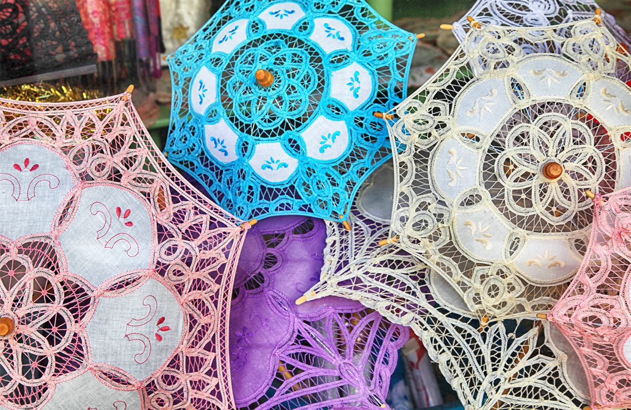 Traditional handmade lace umbrellas in local souvenir shop in Lefkara, image by InnaFelker